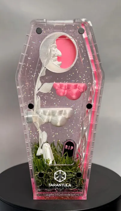 Pink coffin enclosure with a moon and mushrooms