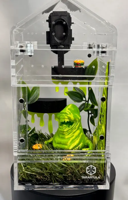 Green slime enclosure with a black mansion