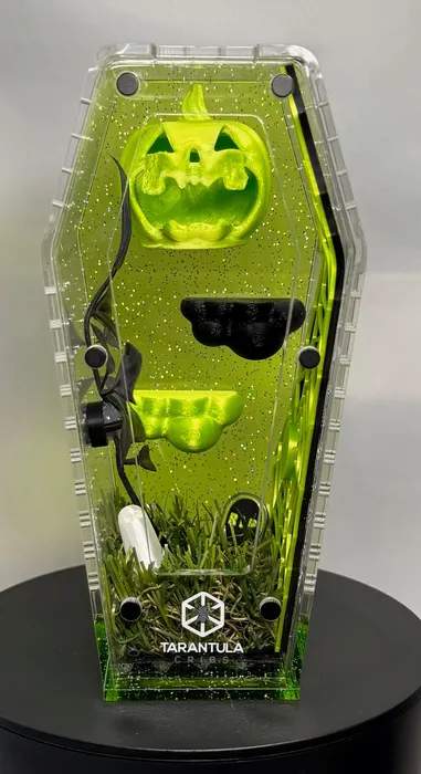 Green coffin enclosure with a jack-o-lantern