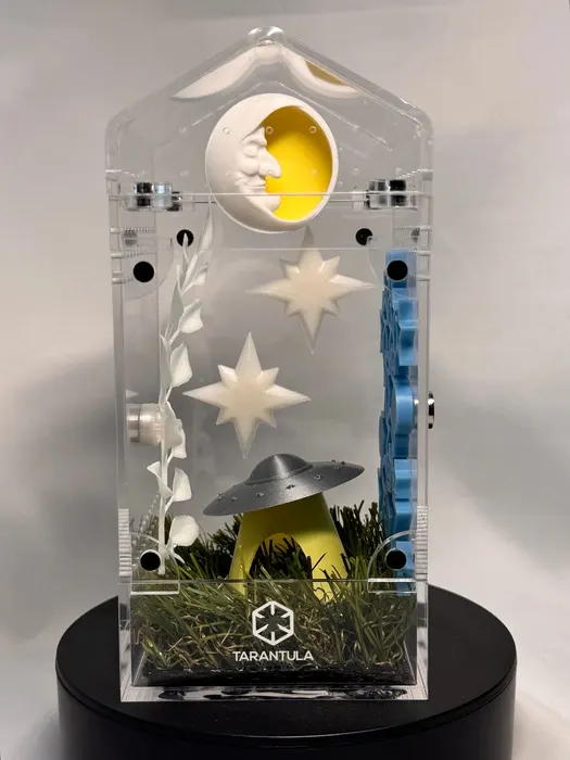 Enclosure with a moon, stars, and a UFO