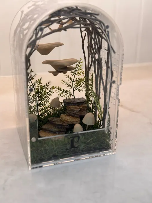 Arch enclosure with a woodland mushroom scene