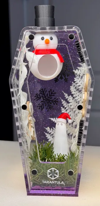 Purple coffin enclosure with a snowman and holiday accents