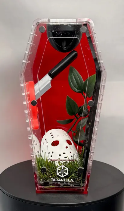 Red coffin enclosure with a hockey mask and knife