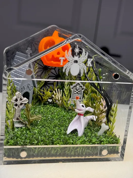 Graveyard enclosure with a pumpkin and skeleton