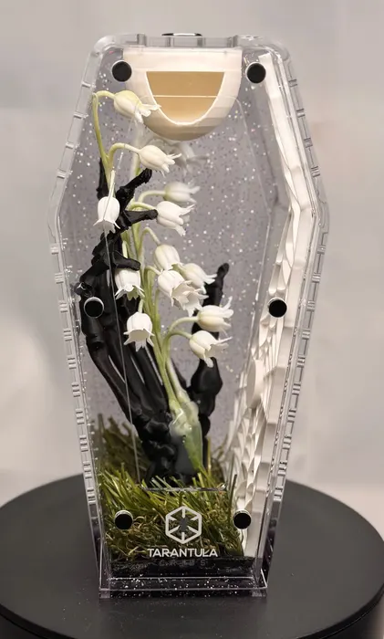 Coffin enclosure with lily of the valley
